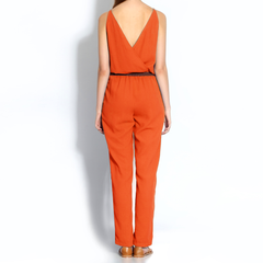 v-necked jumpsuit with faux leather belt in crimson orange