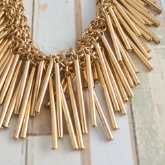 Gold-tone chain necklace with drop bar pendants