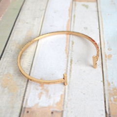 Gold-tone bar bangle with wavy detail