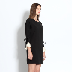 Shift dress with ruffle cuffs in black and cream